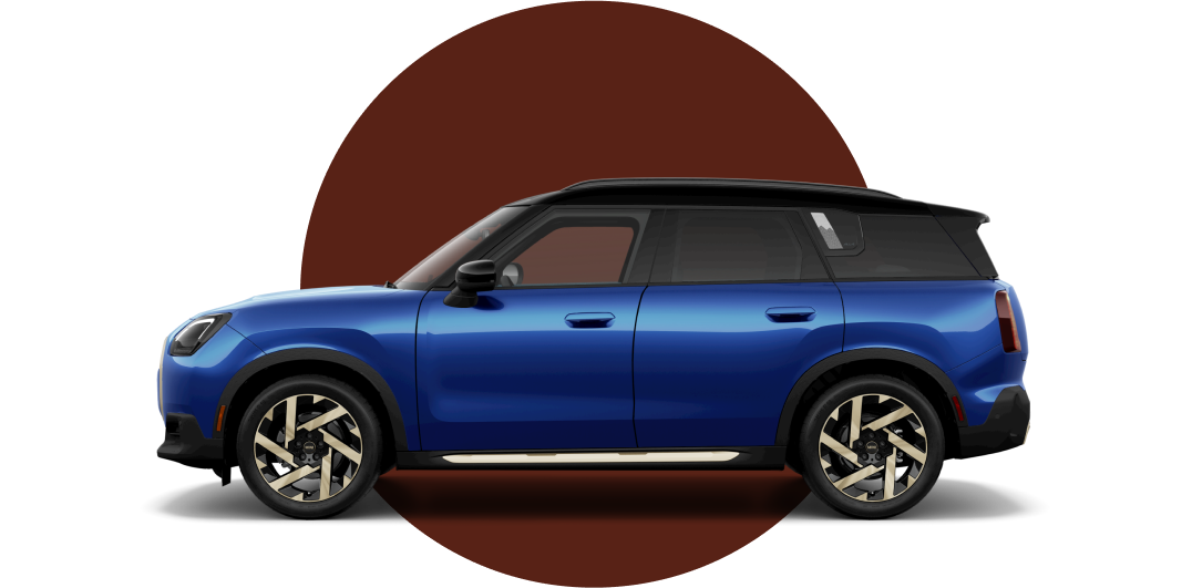 Side view of a MINI Countryman SE ALL4 in the Blazing Blue body color, facing left with its shadow underneath it.