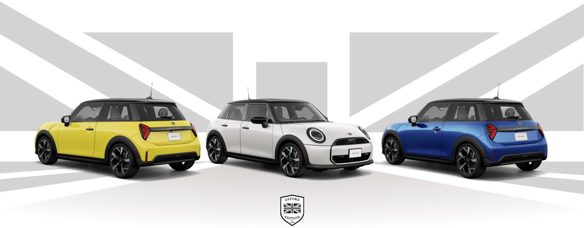Three Oxford Edition MINI Coopers in different colors in front of a Union Jack background.
