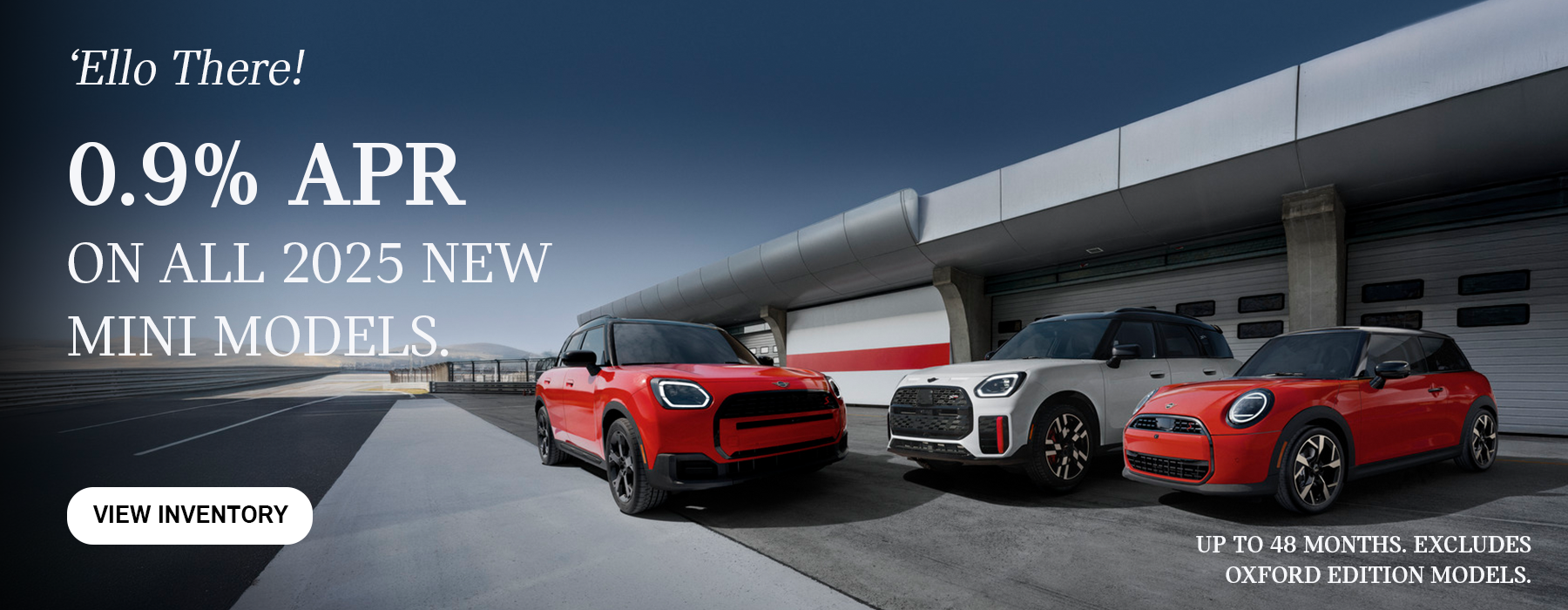 Front view of 3 MINI Cooper's parked infront of garage.