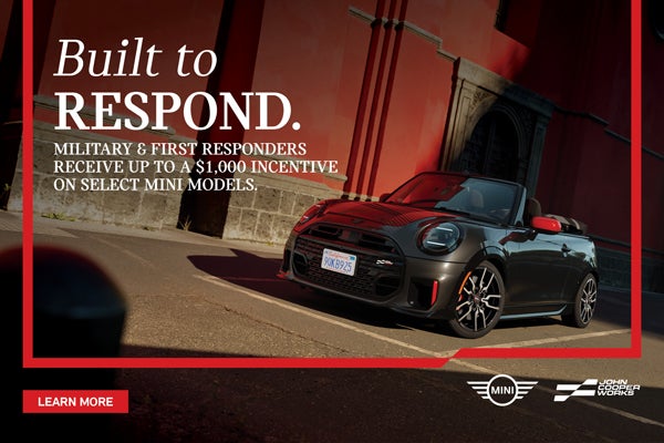 Black JCW Convertible parked.